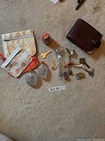 All items laid out: wallet, pouches, snuff bottles, keys, charms, stir stick