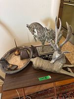 Group view of all metal pieces on table