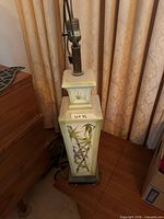 full view of lamp base standing on floor