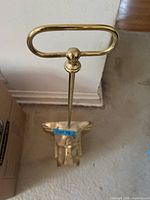Front view showing entire brass elephant doorstop and handle
