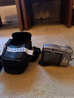Rear view of Canon PowerShot A710 IS with carrying case