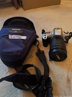 Camera body, lens, strap and Tamrac bag overview