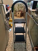 Front view of the 3-step ladder standing open