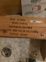 Close-up of French stencilled text on crate side