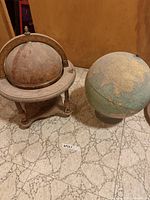 Both globes side by side on floor