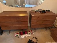 Front view of both matching dressers under mirror