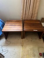 pair of wooden side tables front view