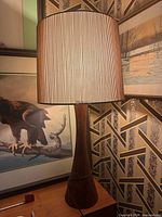 Full view of lamp illuminated on table