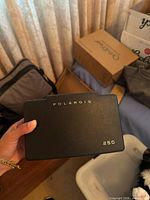 Closed Polaroid Automatic 250 camera showing front cover
