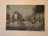 Full view of unframed street scene painting on wall