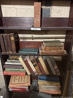 Full shelving unit showing majority of vintage books