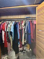 Full closet rod showing variety of garments