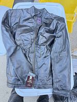 full view of black leather jacket front