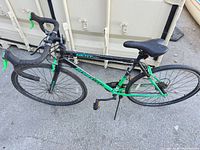 Full view of BordTech road bike showing frame color, wheel size, handlebars and kickstand