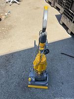 Full view of Dyson DC07 vacuum from above showing overall condition, hose and handle