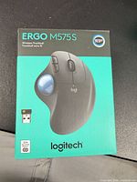 Front of retail box showing model and image of trackball mouse