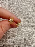 Front view of both starfish stud earrings showing cubic zirconia accents