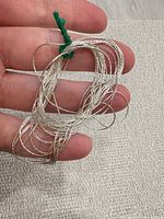 bundle of silver twisted rope chain held in hand, showing overall appearance