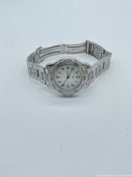 Front view of watch showing dial, bezel and bracelet