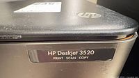 HP Deskjet 3520 model badge on front corner