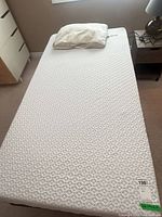 Top view of twin mattress with pillow