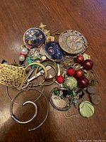 Pile view of assorted earrings on table