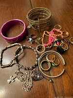Group shot of all jewelry pieces on table surface
