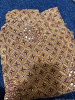 Folded batik fabric showing overall geometric pattern
