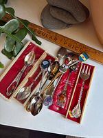 Group shot of all spoons and fork on presentation boxes