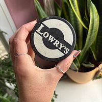 Front view showing Lowry's logo on puck face