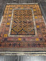 Full view of rug showing overall design and fringe