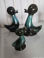Three Blue Mountain Pottery duck figurines grouped together