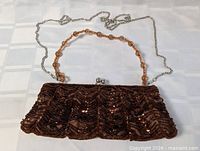 Full view of the beaded purse with bead-and-chain strap laid out