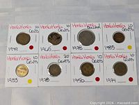Eight coin holders front view