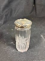 Front view of crystal vanity jar with sterling lid
