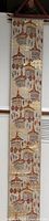 Full length view of embroidered silk hanging on wooden hanger