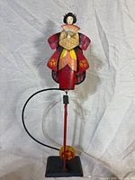 Full view of balancing sculpture assembled on stand
