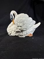 front view of glazed ceramic swan planter