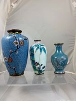 Three cloisonné vases front view