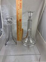 Both candlesticks beside ruler showing relative heights
