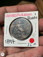 Front of coin in 2x2 holder showing seated Britannia and date 1897