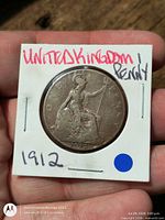 Reverse of coin showing seated Britannia and date 1912 in cardboard flip