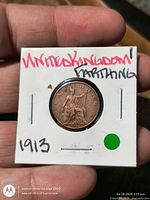 Reverse of 1913 farthing showing seated Britannia in holder