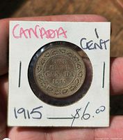 Front of coin in 2×2 flip showing reverse legend and date