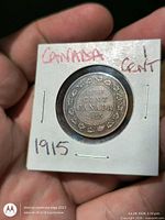 Reverse side showing ONE CENT CANADA 1915 within wreath