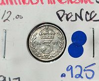 Reverse of 1917 threepence in holder, showing crowned 3 and date
