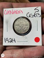 Reverse view of coin in 2×2 flip showing FIVE CENTS and date 1924