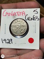 Reverse of 1929 Canada five-cent coin in 2×2 flip