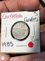 Reverse of 1933 Canada 5-cent coin in 2×2 holder