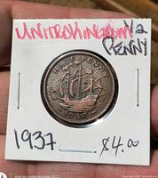 Coin in holder showing reverse and date 1937